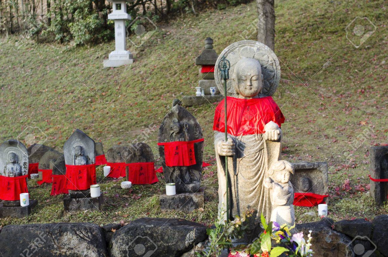 15336958-small-buddha-statues-with-red-mantles-in-nara-japan.jpg