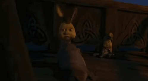 a close up of a cartoon character 's face with the words `` dada '' written below it .