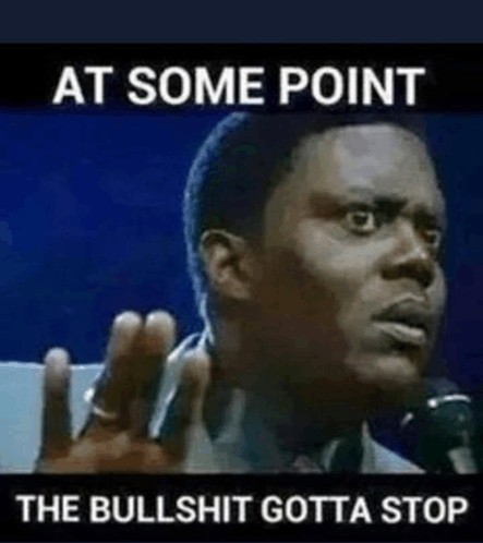 a man is talking into a microphone with the words `` at some point the bullshit gotta stop '' above him .