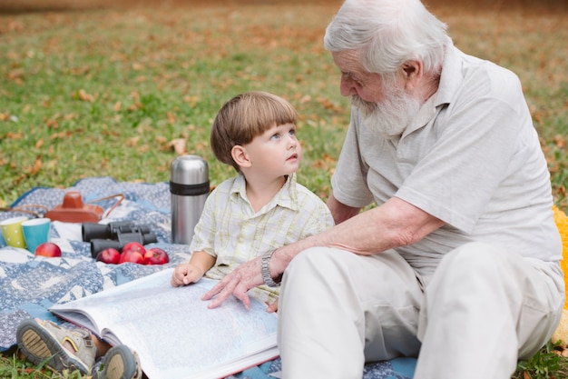 grandpa-telling-stories-grandson_23-2148294873.jpg