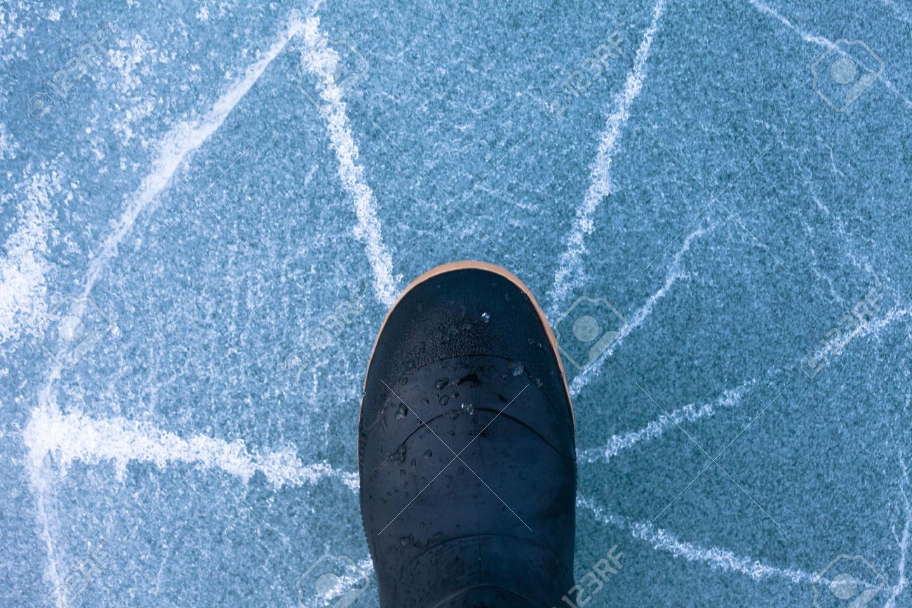 17840880-thin-ice-cracking-under-weight-of-rubber-boot-human-foot-walking-with-cracks-radiating-outwards-sign.jpg