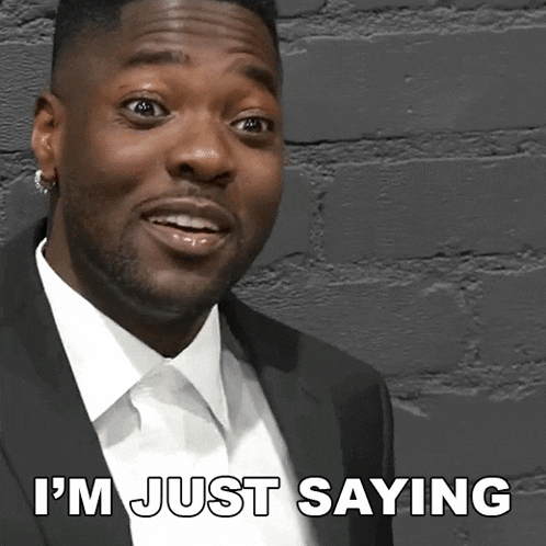 a man in a suit and white shirt is saying i 'm just saying