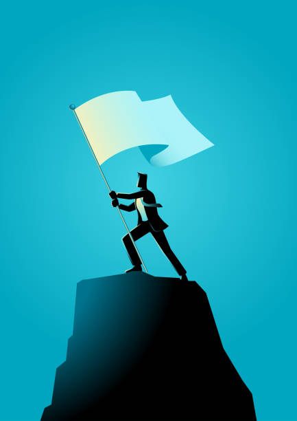 businessman-holding-a-flag-on-top-of-rock.jpg